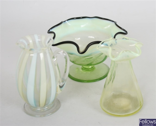 A Vaseline glass vase with crimped and frilled