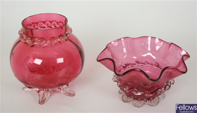 A cranberry and clear glass vase of bulbous form,