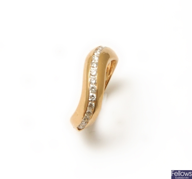 An 18ct gold round brilliant diamond set curved