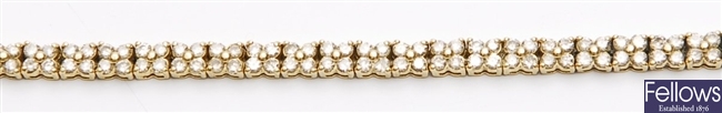 An 18ct gold diamond set bracelet, each link