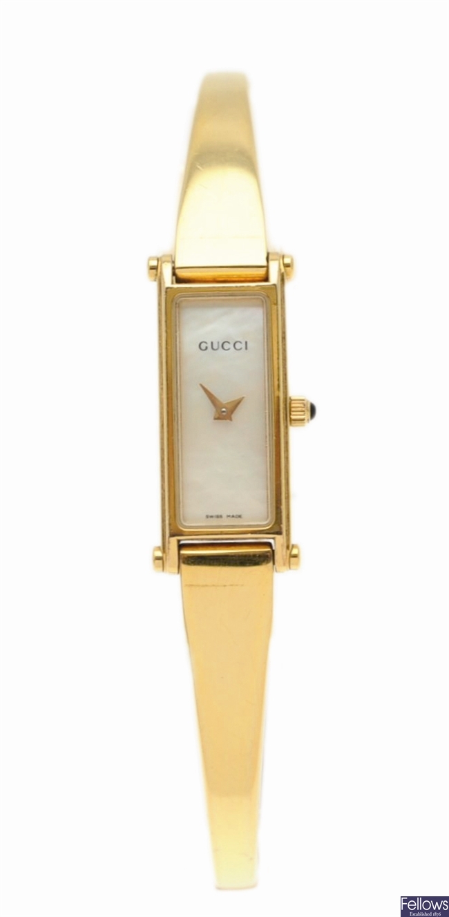 GUCCI - a gold plated quartz lady's bangle watch,