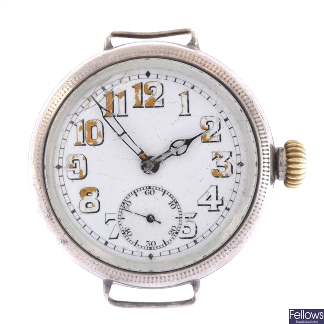 A silver trench style watch head.
