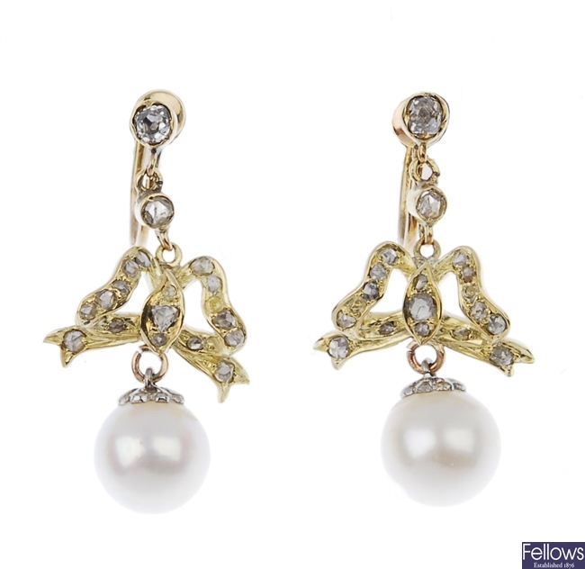 A pair of diamond and cultured pearl drop earrings.