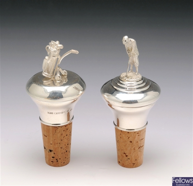 Two silver mounted golf bottle stoppers