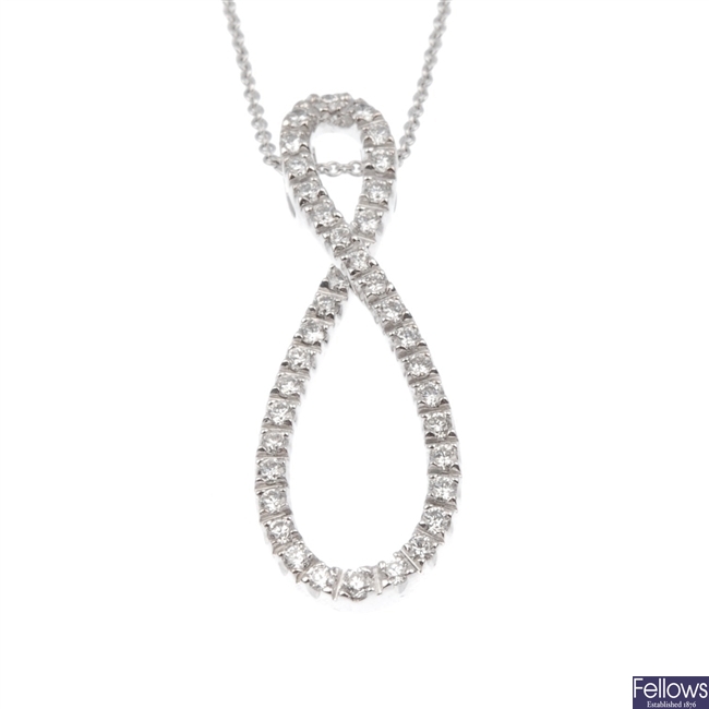 18ct white gold twist desgin diamond pendant with chain.