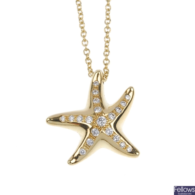 Tiffany & Co - an 18ct gold diamond set starfish pendant with box.
