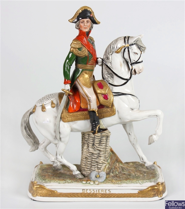 A Naples porcelain figure depicting Princess Anne together with a selection of other figurines