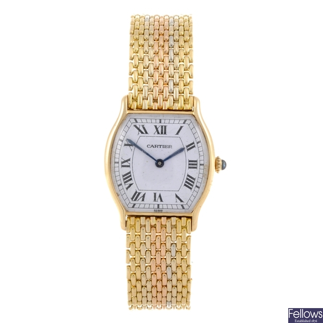 An 18k gold Cartier bracelet watch.