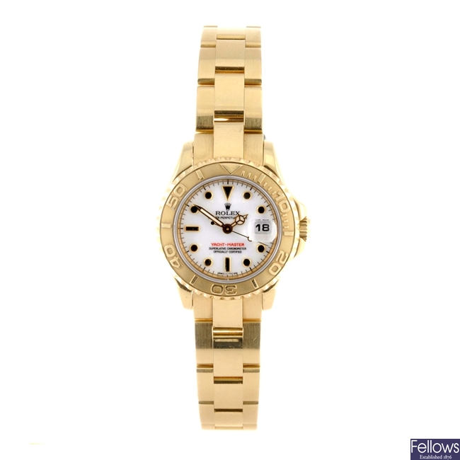 An 18k gold automatic lady's Rolex Yachtmaster bracelet watch.