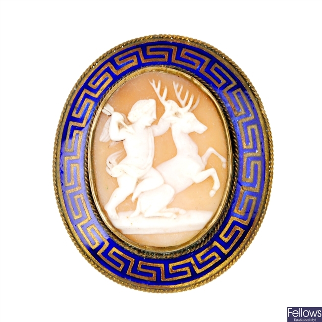 An enamel cameo brooch and a pair of ear pendants. 