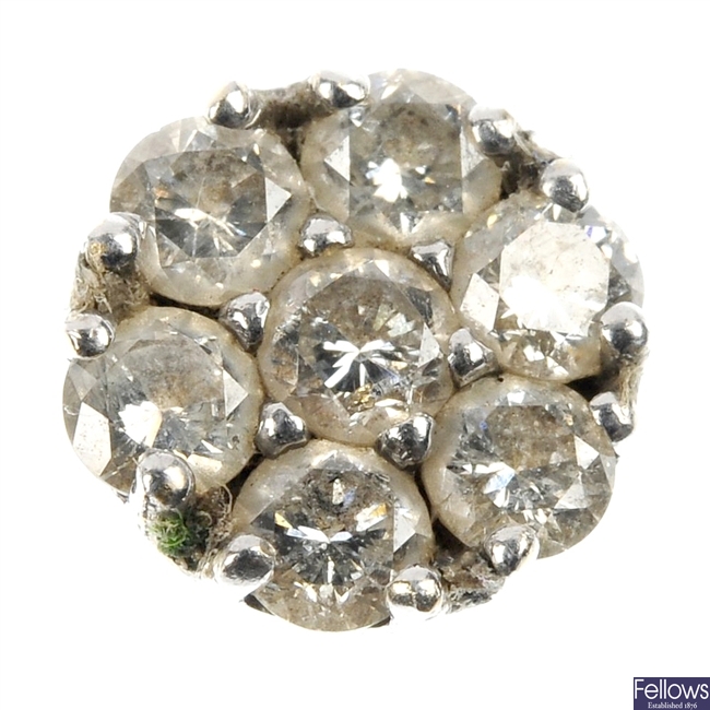 A brilliant-cut diamond floral cluster panel.