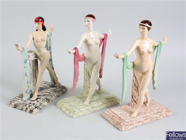 A Kevin Francis ceramic figurine and two other figurines