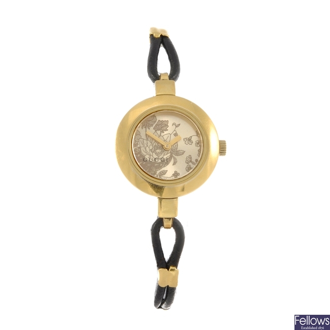A gold plated quartz lady's Gucci wrist watch.