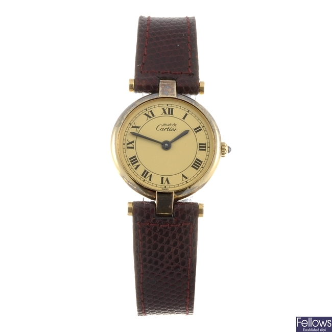 A gold plated quartz lady's Cartier wrist watch.