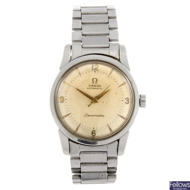 A stainless steel Omega Seamaster bracelet watch.