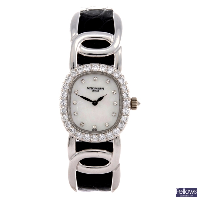 An 18k white gold diamond set manual wind lady's Patek Philippe wrist watch.