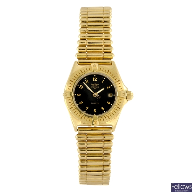 An 18k gold quartz lady's Breitling bracelet watch.