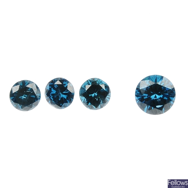 Four loose colour treated brilliant-cut blue diamonds.