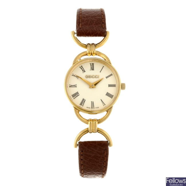 A gold plated quartz lady's Gucci 6000.2.L wrist watch.
