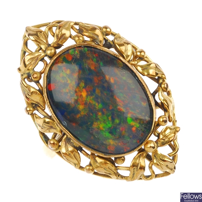 An opal triplet ring.