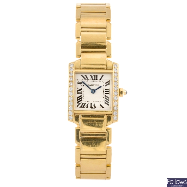 An 18k gold quartz lady's Cartier Tank Francaise bracelet watch.