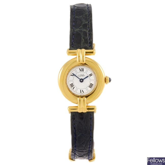 A gold plated quartz lady's Must De Cartier wrist watch.