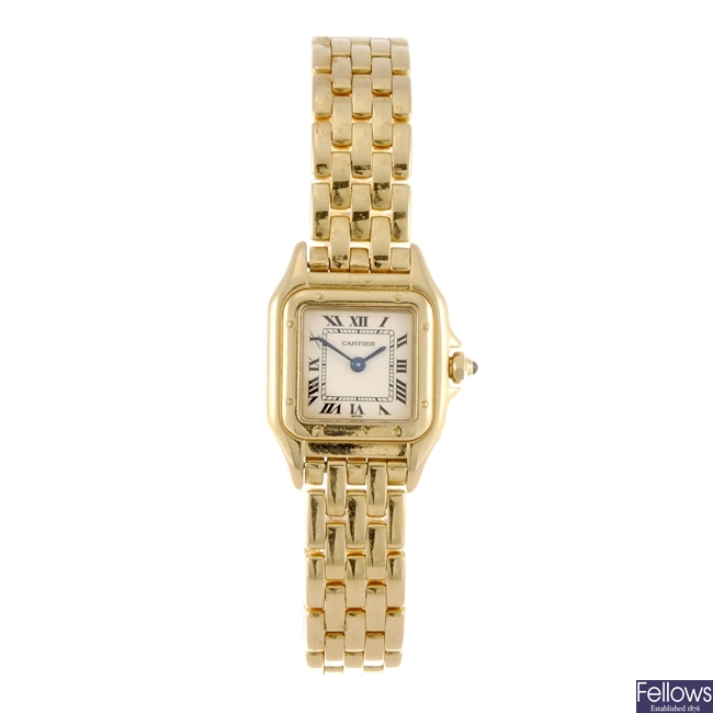 An 18k gold quartz lady's Cartier Panthere bracelet watch.