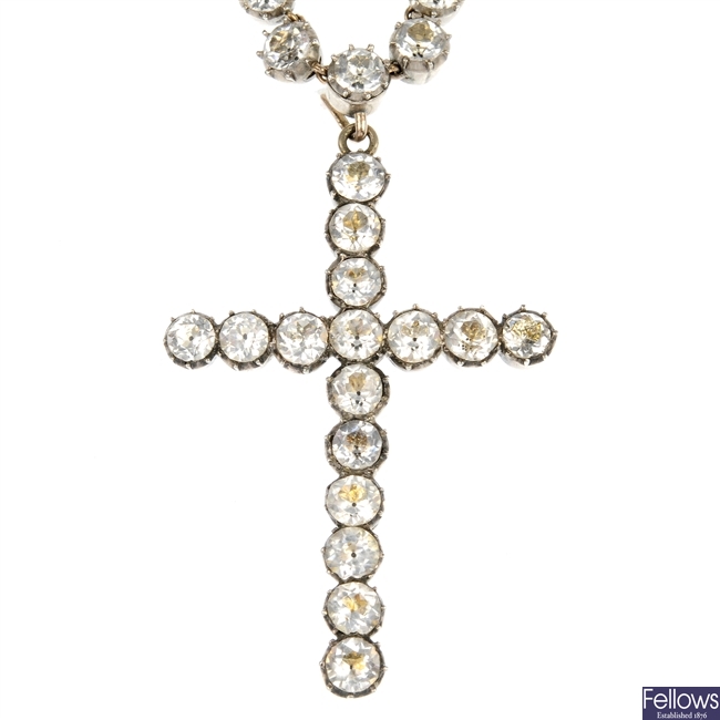 An early 20th century colourless paste cross pendant and necklace.