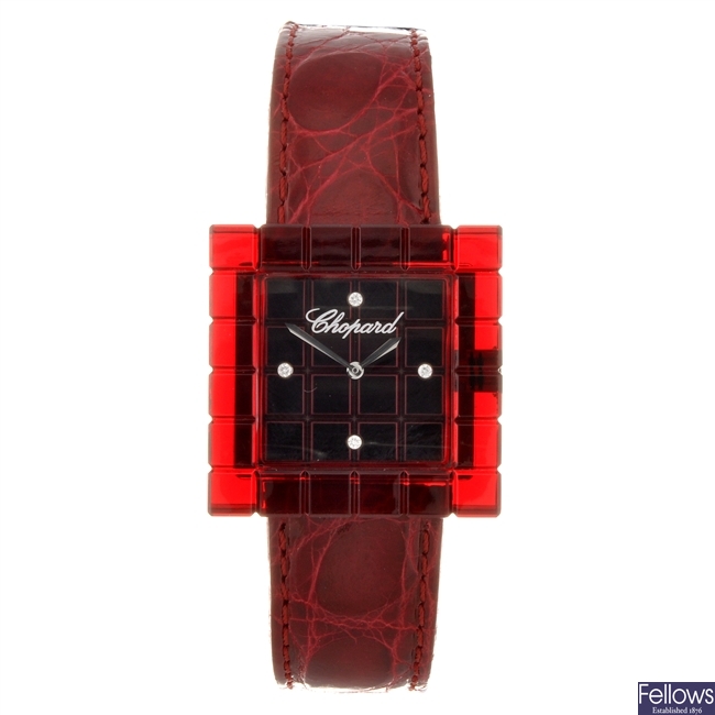 A red resin quartz lady's Chopard wrist watch.
