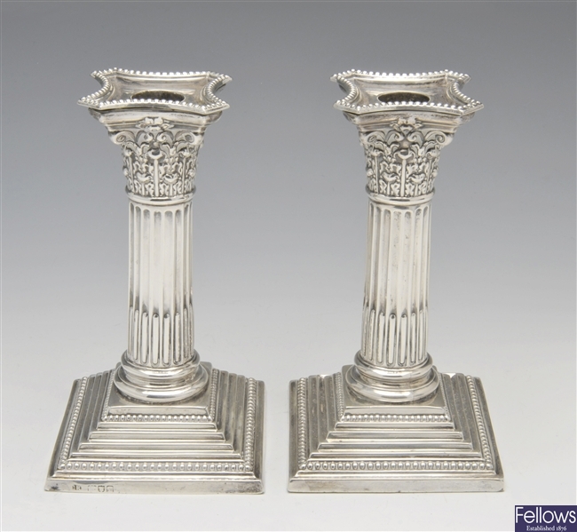 Edwardian silver mounted pair of candlesticks.