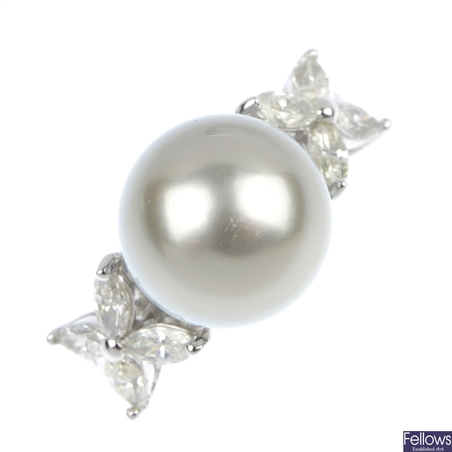 A cultured pearl and floral diamond ring.