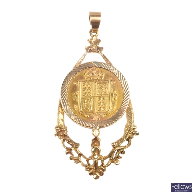A half sovereign pendant.