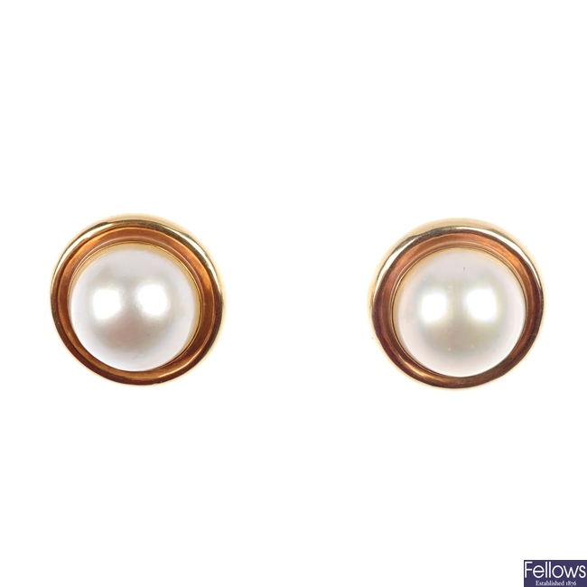 A pair of mabe pearl earrings.
