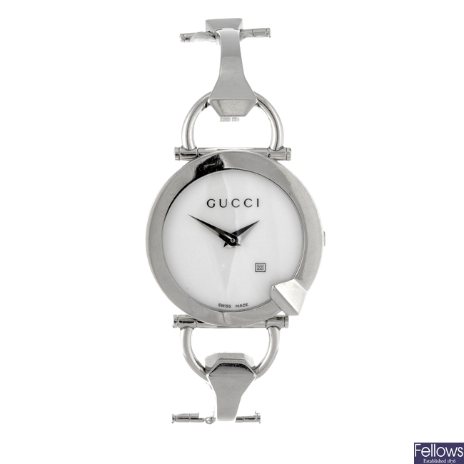 A stainless steel quartz lady's Gucci bangle watch.