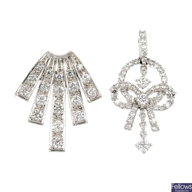 A selection of jewellery to include two diamond pendants.