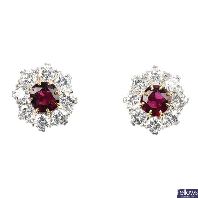 A pair of 18ct gold garnet and diamond cluster ear studs.