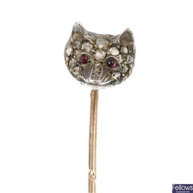 A late 19th century silver and gold rose-cut diamond and synthetic ruby fox head stickpin.