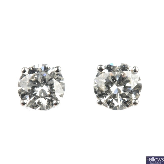 A pair of 18ct gold diamond single-stone ear studs. 