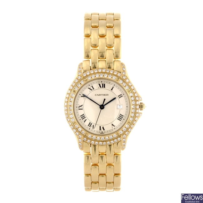 (121078586) An 18k gold quartz gentleman's Cartier Cougar bracelet watch.