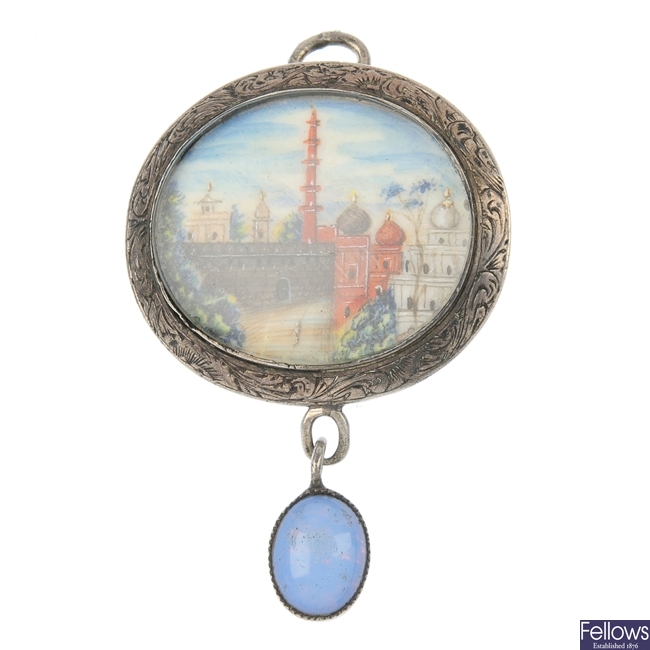 A hand-painted miniature pendant.