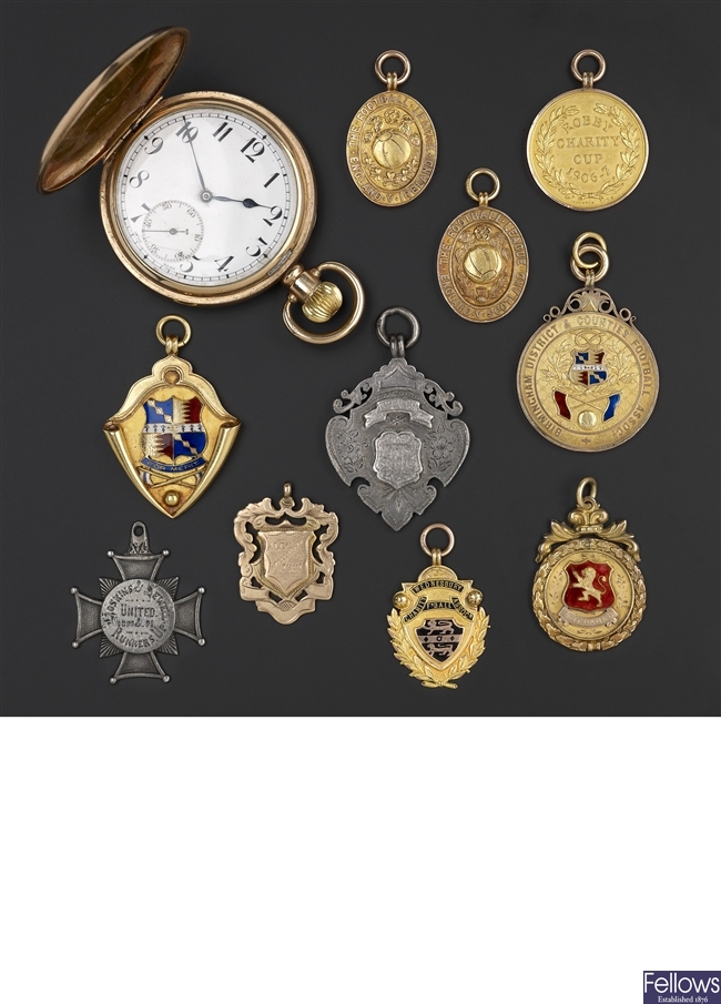 A collection of AVFC medals including two pocket watches.