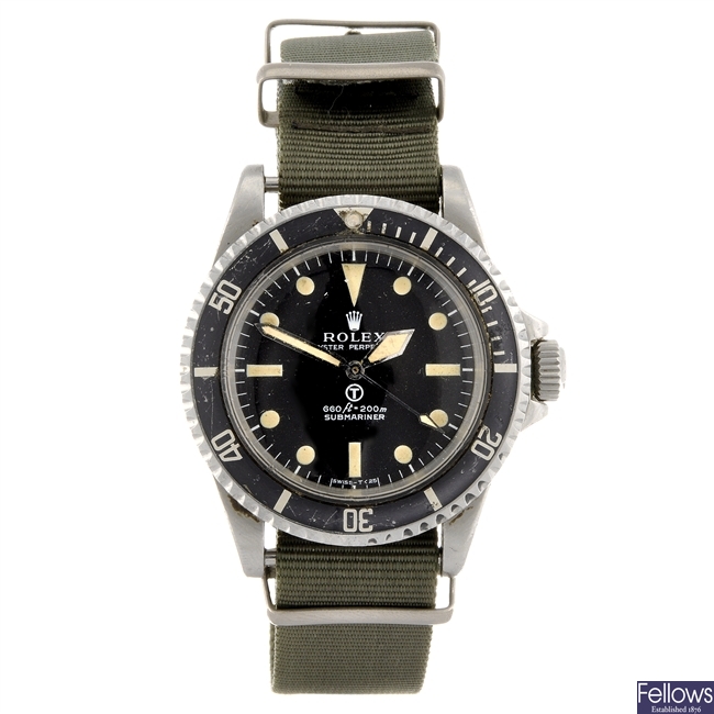 A stainless steel automatic naval issue Rolex Oyster Perpetual Submariner wrist watch.