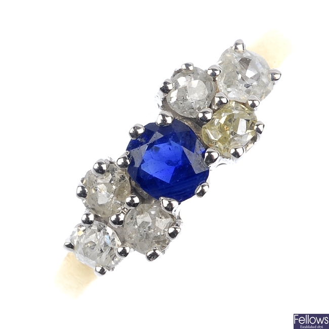 A sapphire and diamond seven stone ring.