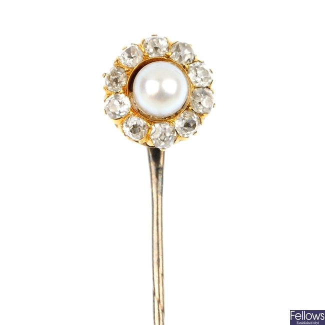An 20th century cultured pearl and diamond cluster stick pin.
