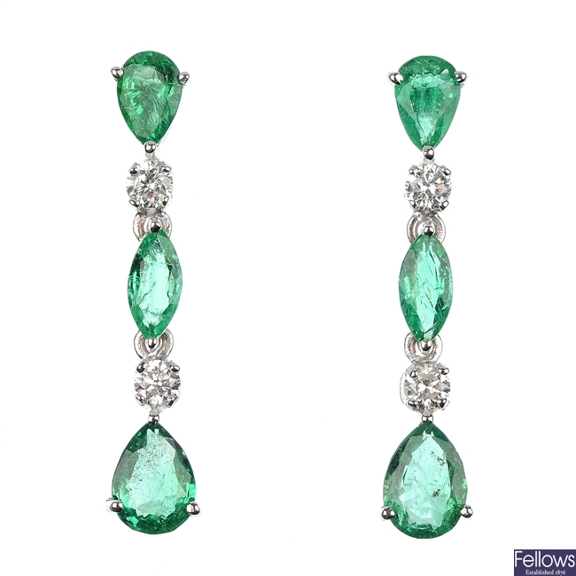 A pair of emerald and diamond ear pendants.