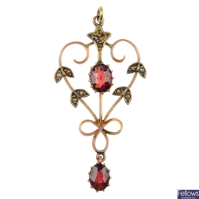 An early 20th century garnet and seed pearl pendant.