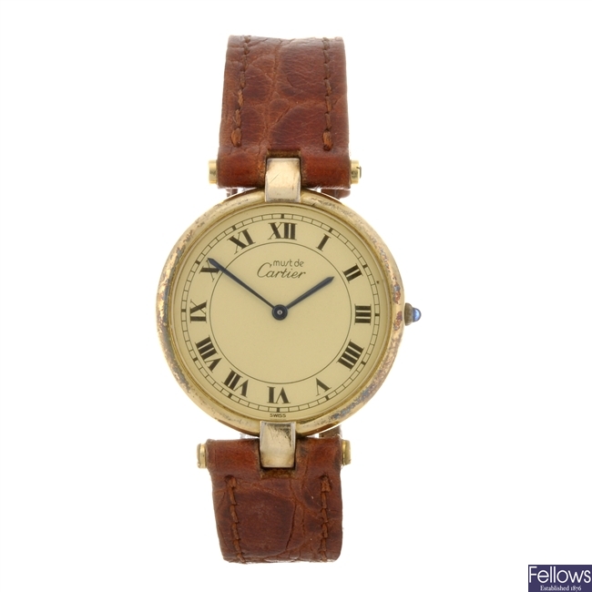 (3632) A gold plated quartz gentleman's Cartier Vermeil wrist watch with two similar examples.