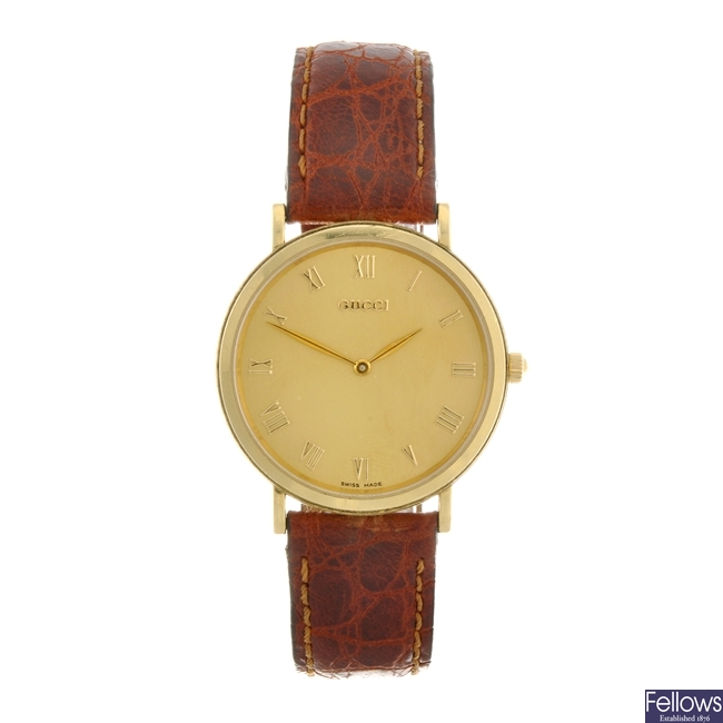 (220979014) An 18k gold quartz gentleman's Gucci wrist watch.