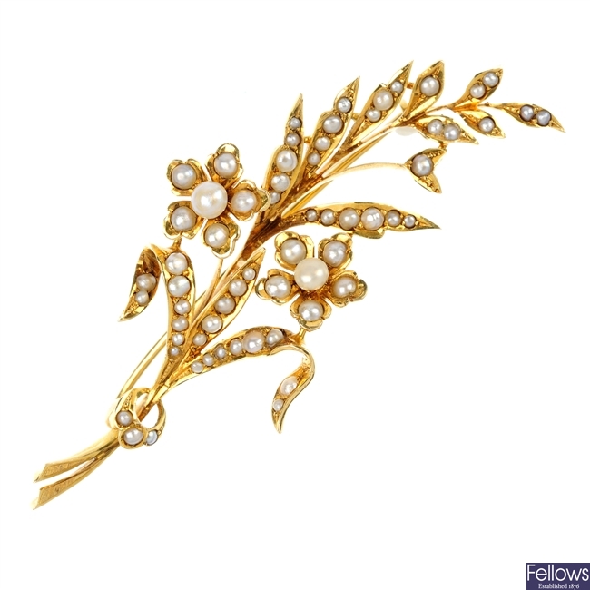 An early 20th century gold split pearl foliate spray brooch.