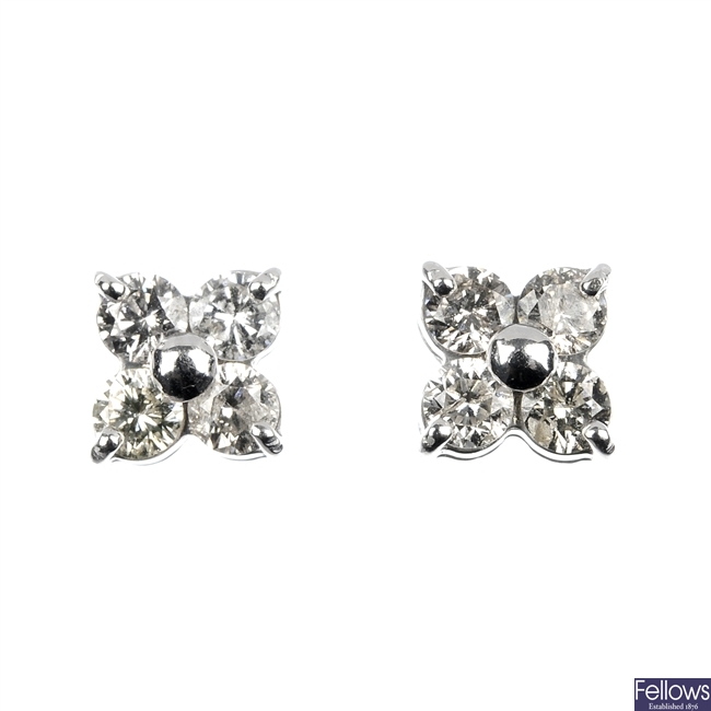 A pair of diamond floral ear studs.